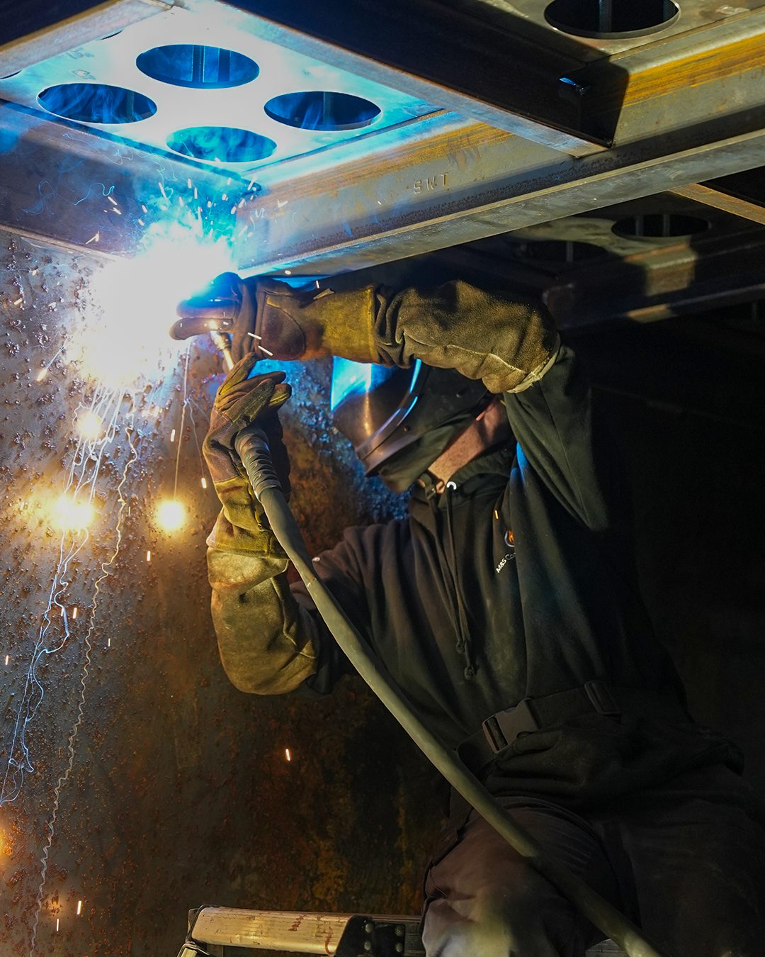 Welding inside a bespoke heavy-plate steel assembly