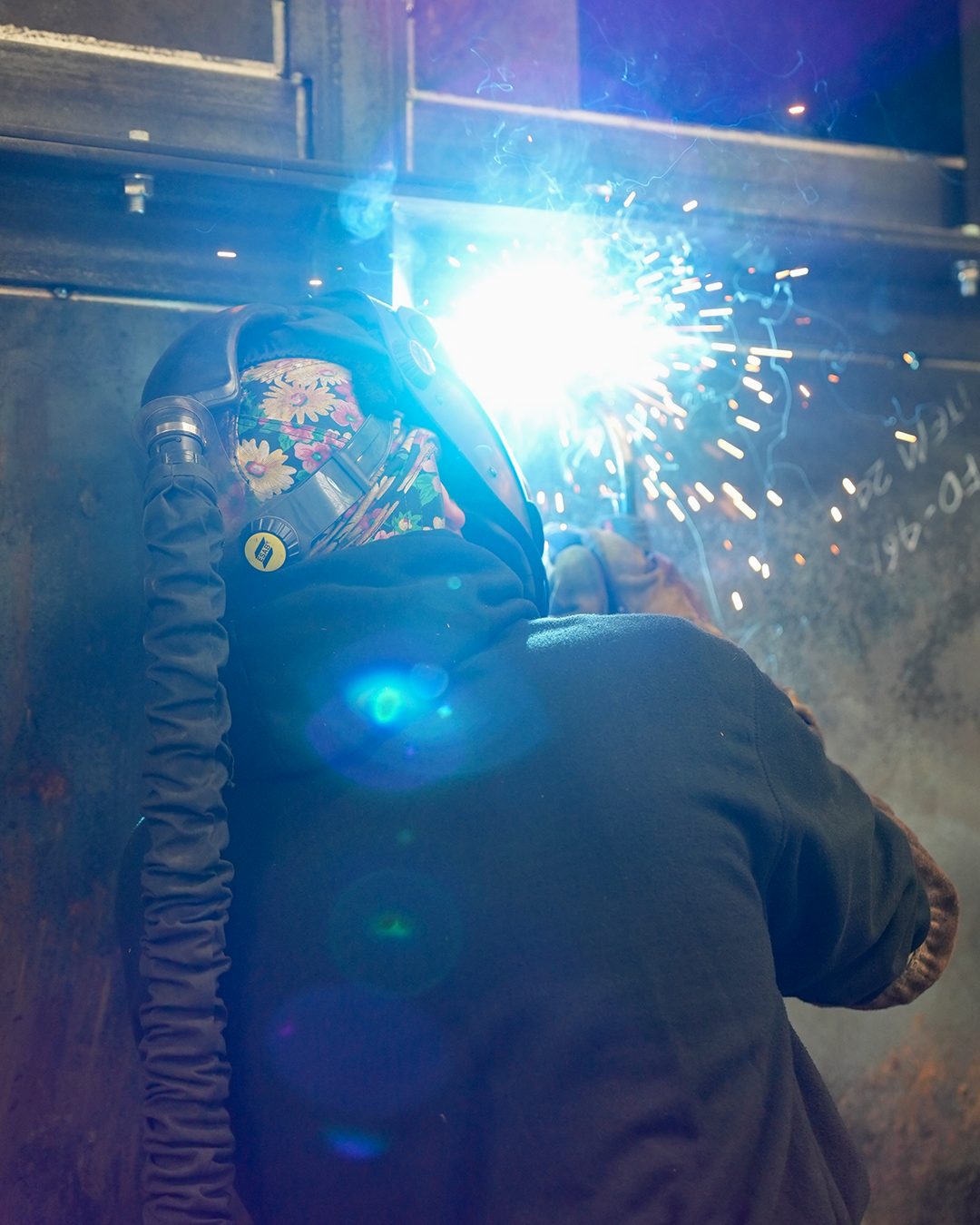 Item-numbered plate being welded to drawing